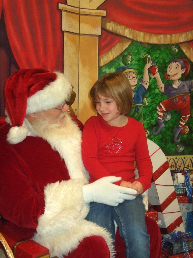photo of a girl and santa